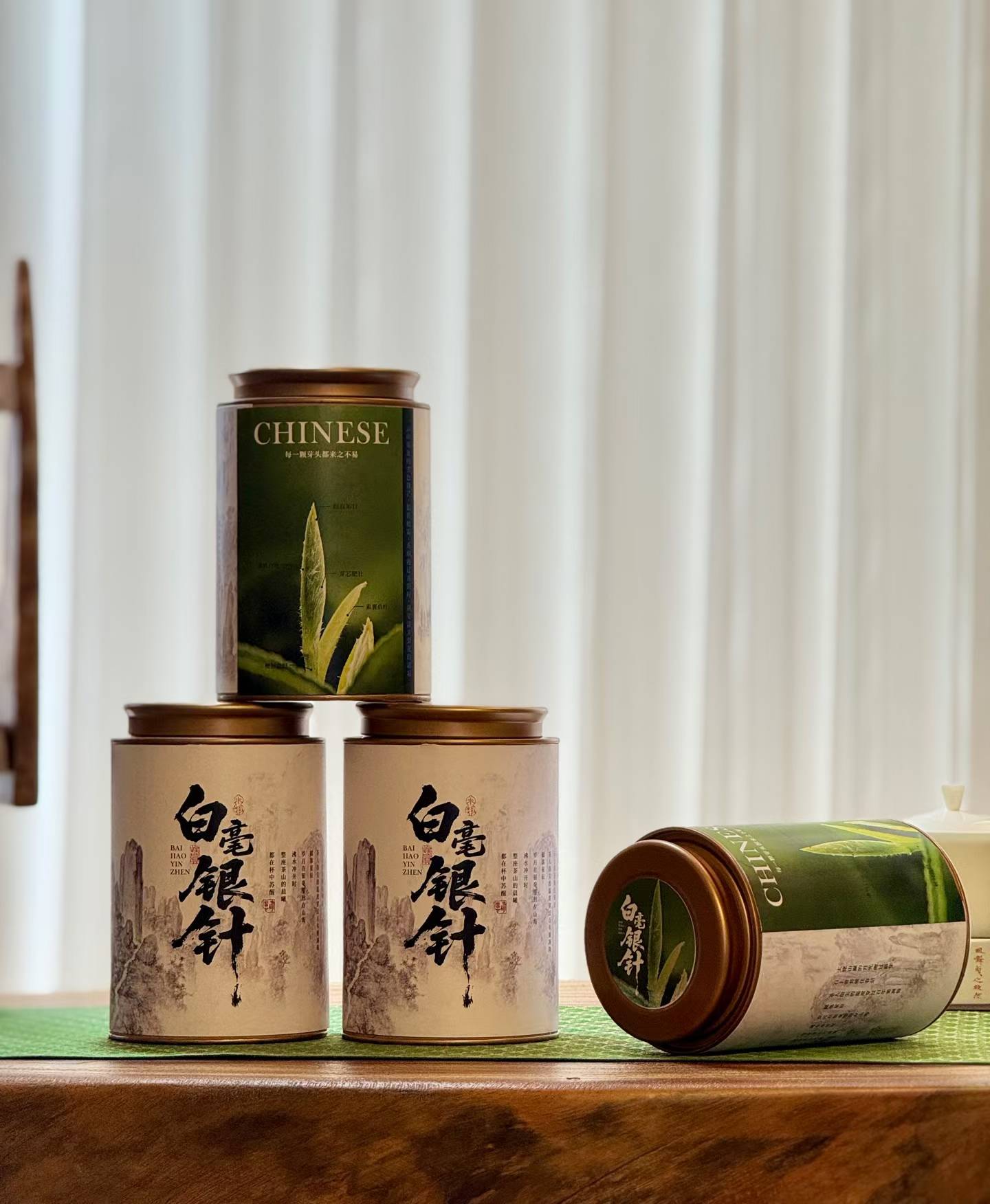 Aged Silver Needle white tea from 2020, six years matured. High-mountain single buds, honeyed aroma, warm medicinal notes, clear golden liquor. Four sealed tins — drink now or keep aging.