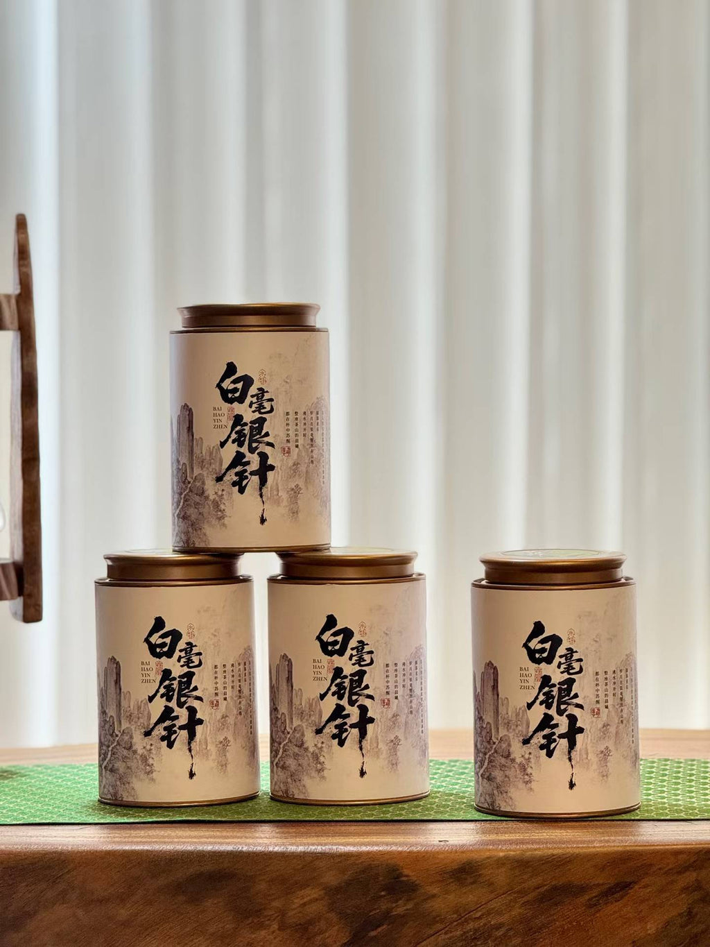 Aged Silver Needle white tea from 2020, six years matured. High-mountain single buds, honeyed aroma, warm medicinal notes, clear golden liquor. Four sealed tins — drink now or keep aging.