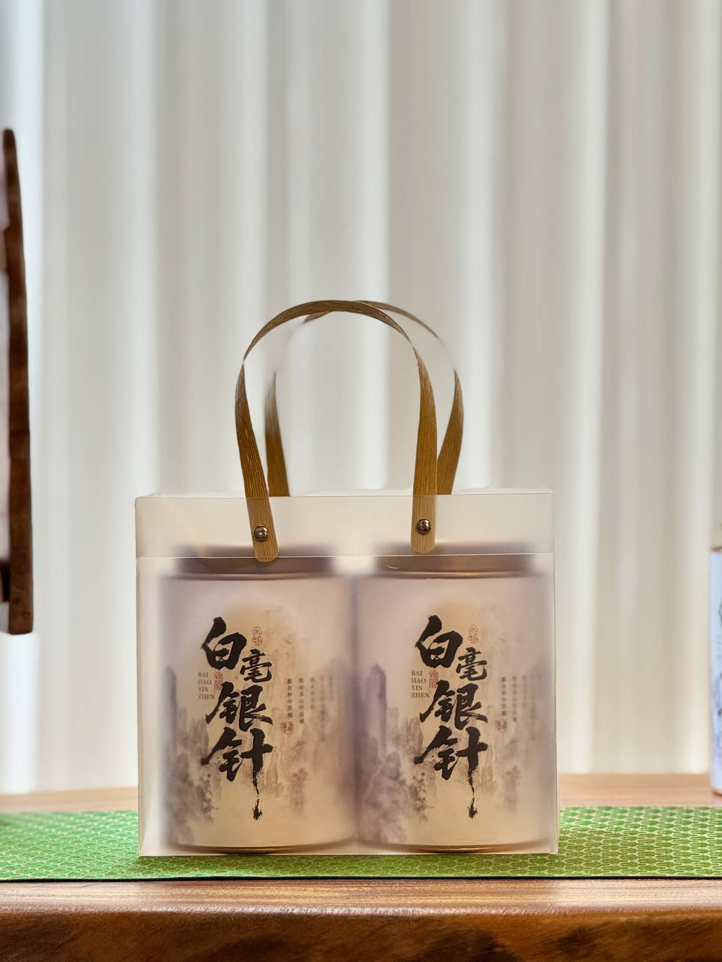 Aged Silver Needle white tea from 2020, six years matured. High-mountain single buds, honeyed aroma, warm medicinal notes, clear golden liquor. Four sealed tins — drink now or keep aging.