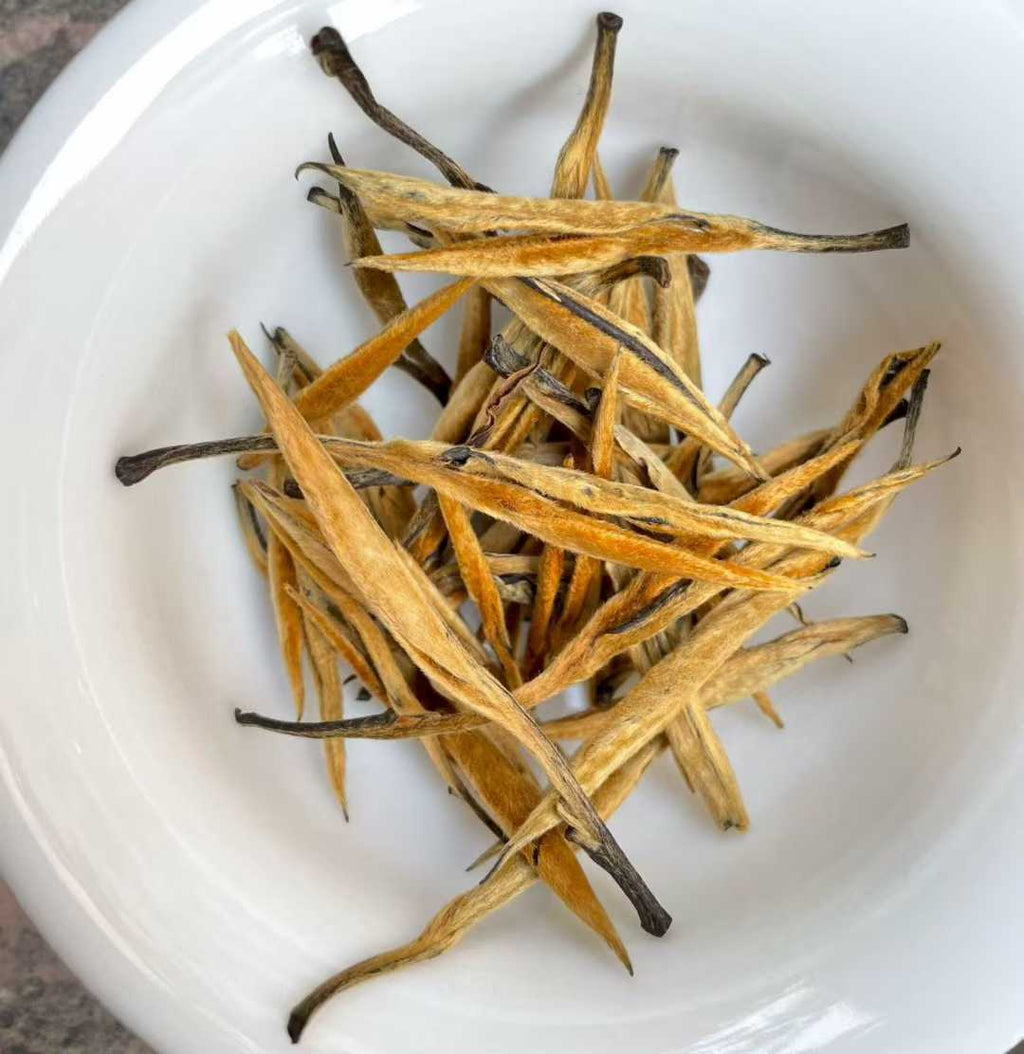Golden Needle Black Tea 2026 New Harvest Dried tea leaves in a white bowl