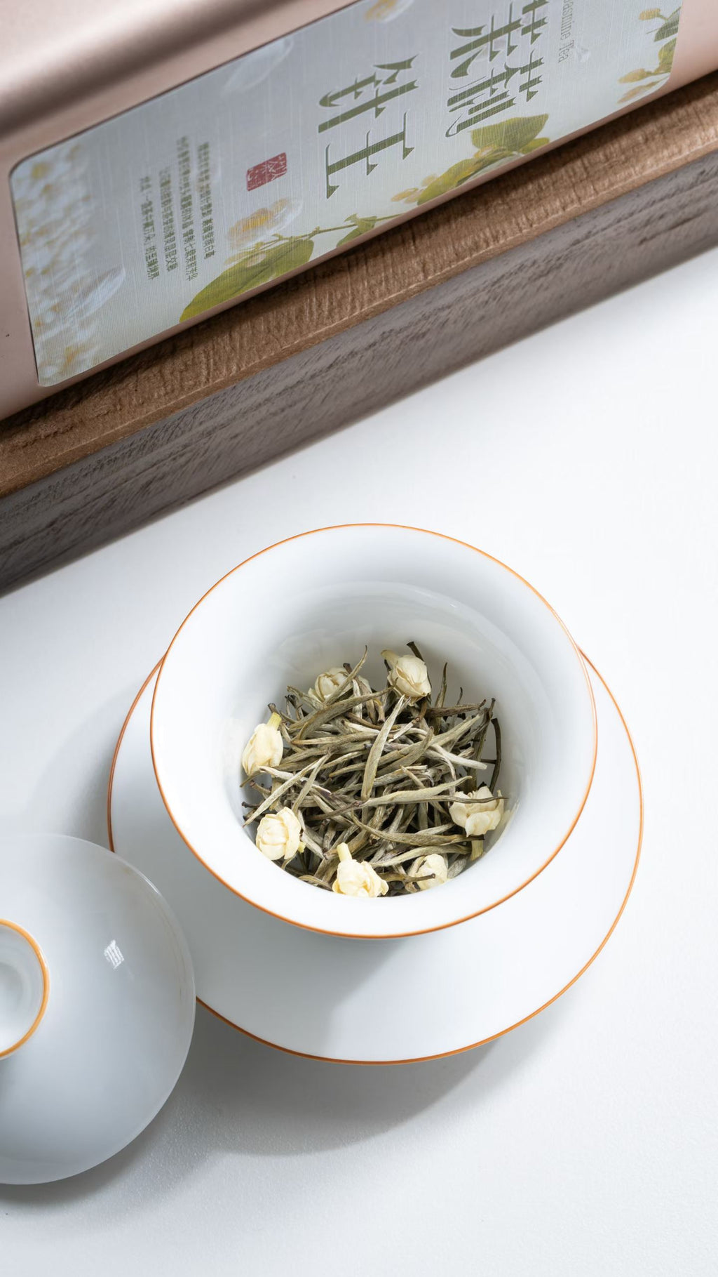 jasmine Needle King -- silver needle tea scented multiple rounds with fresh jasmine. Rock sugar sweet, 10+ steeps, fragrance that holds. 2026 spring harvest.
