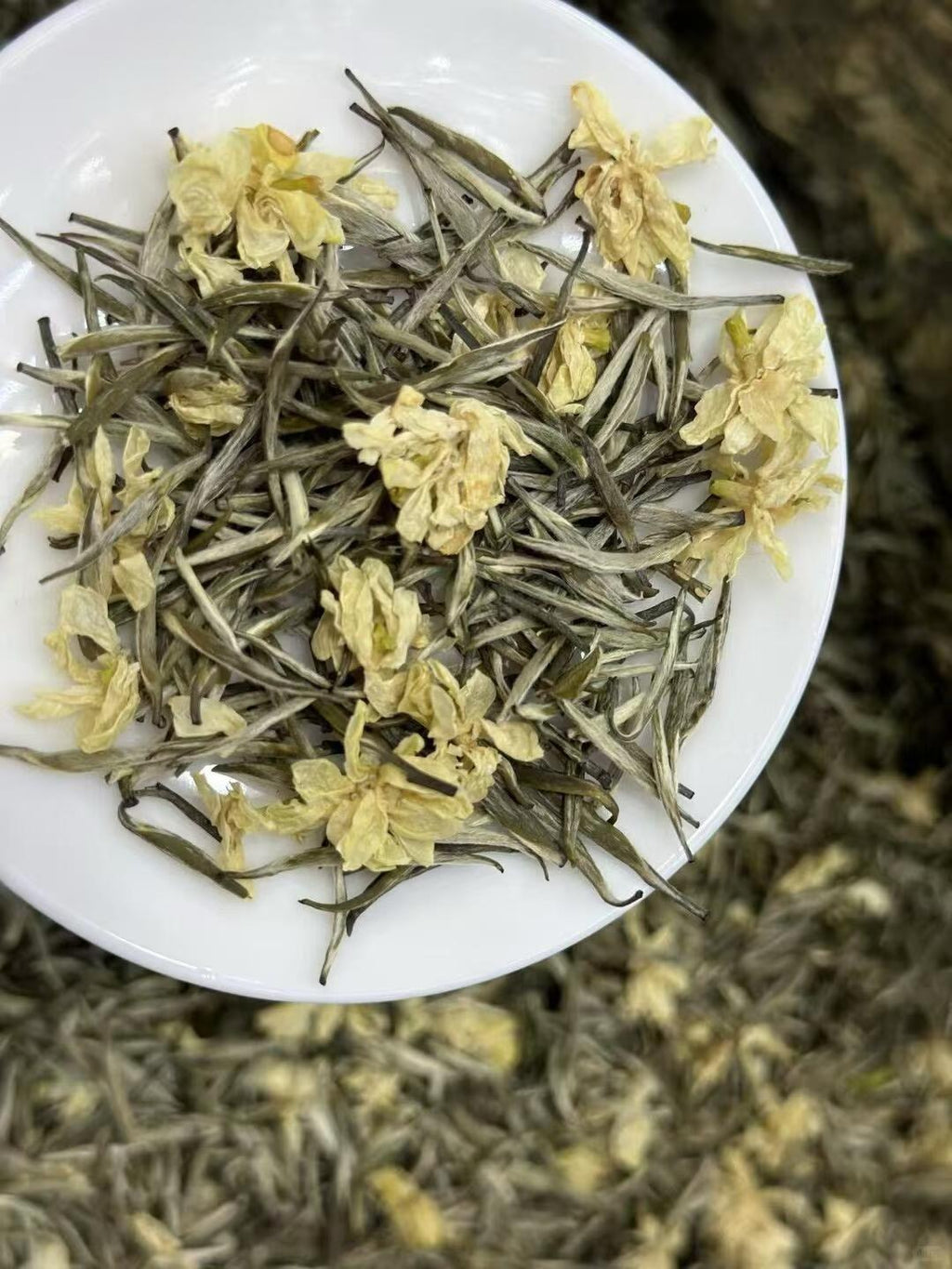 Jasmine Needle King -- silver needle tea scented multiple rounds with fresh jasmine. Rock sugar sweet, 10+ steeps, fragrance that holds. 2026 spring harvest.