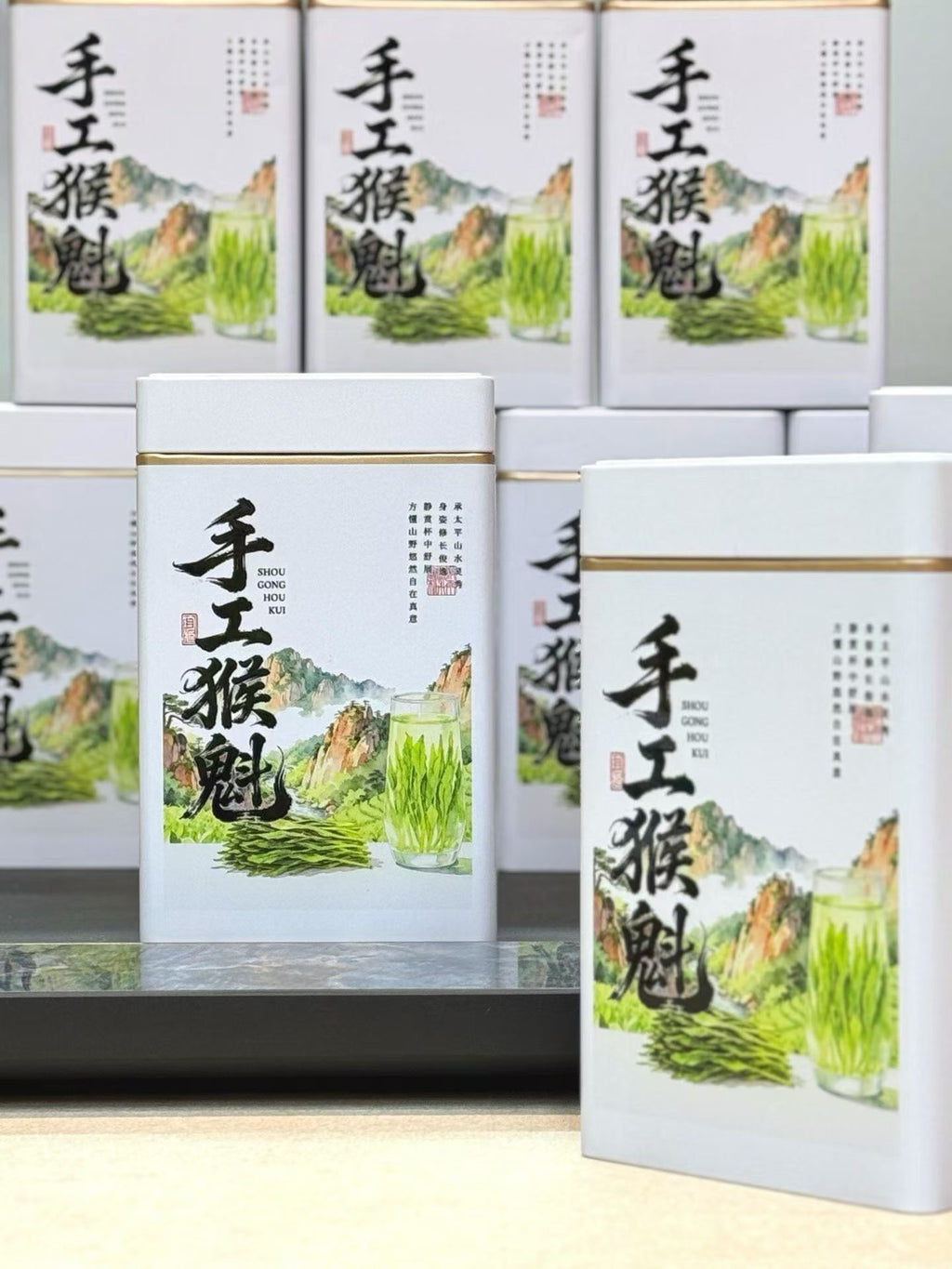 Taiping Houkui hand-pressed green tea from Huangshan's high mountains. First-flush leaves, intangible-heritage craft, sword-straight blades, clear emerald liquor. Orchid-soft and sweet.