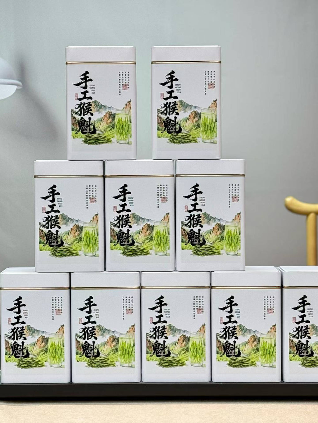 Taiping Houkui hand-pressed green tea from Huangshan's high mountains. First-flush leaves, intangible-heritage craft, sword-straight blades, clear emerald liquor. Orchid-soft and sweet.