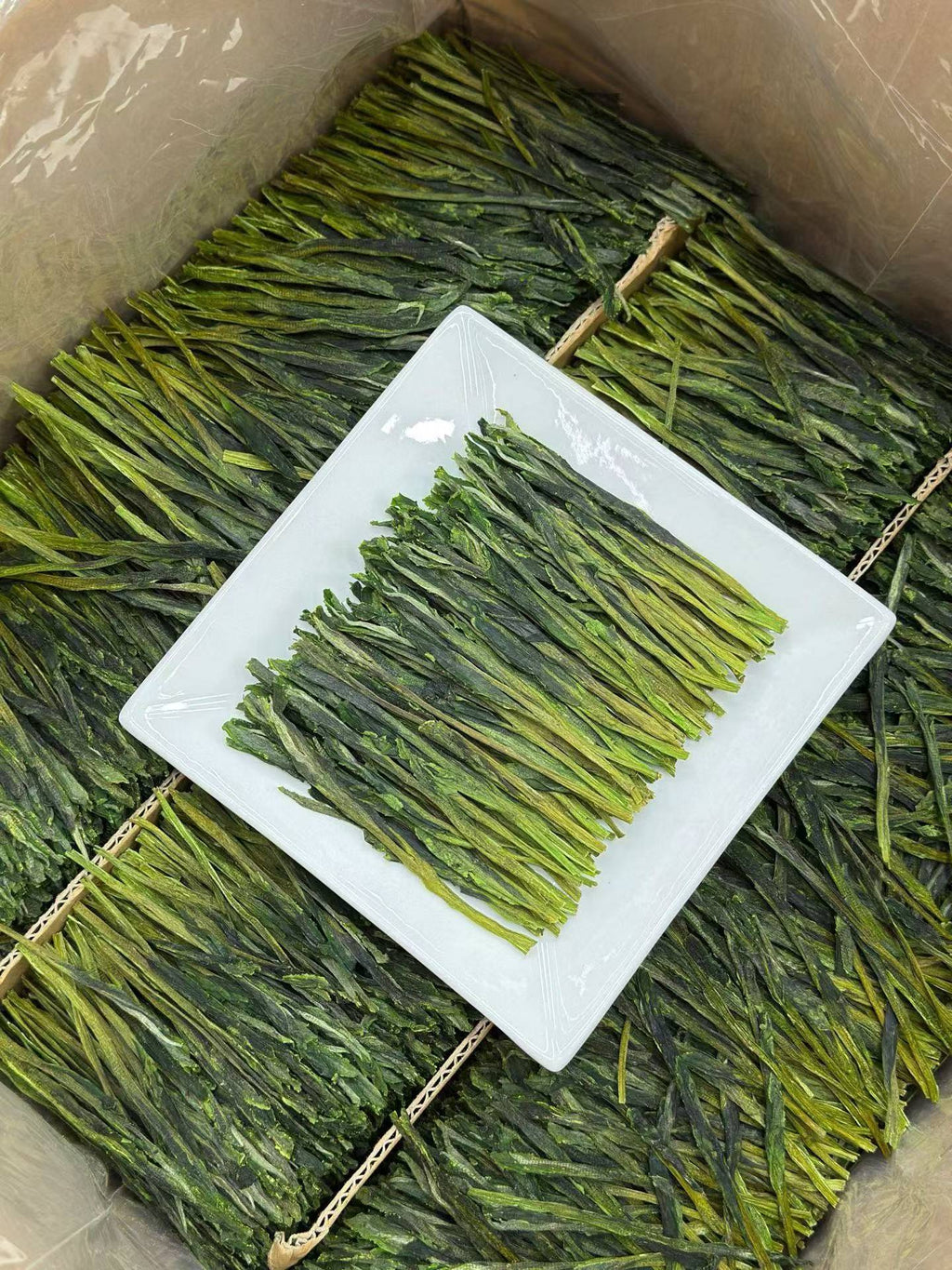 Taiping Houkui hand-pressed green tea from Huangshan's high mountains. First-flush leaves, intangible-heritage craft, sword-straight blades, clear emerald liquor. Orchid-soft and sweet.
