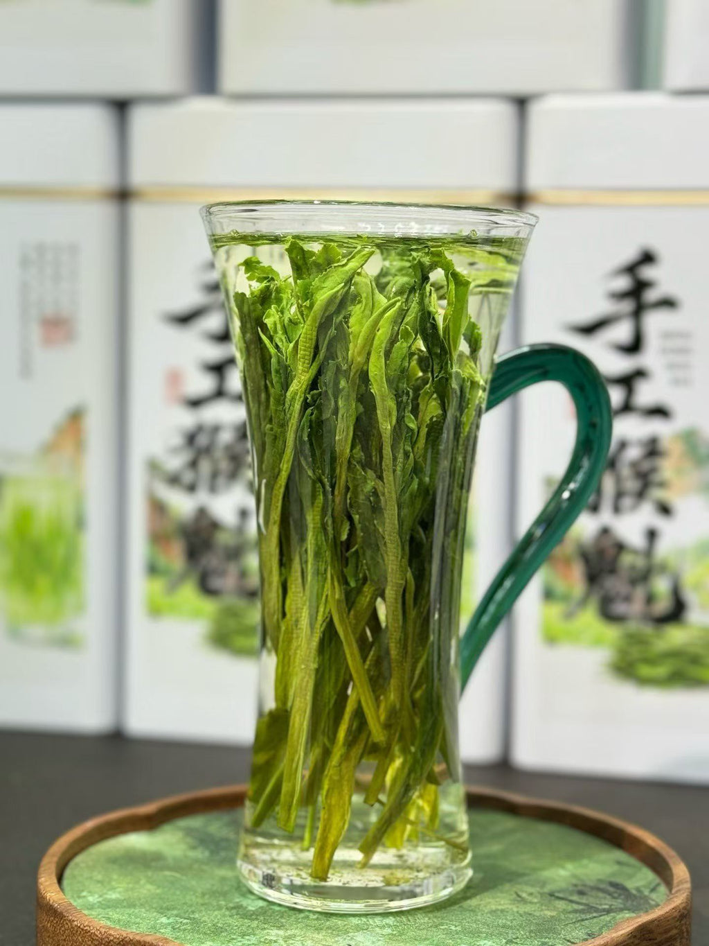 Taiping Houkui hand-pressed green tea from Huangshan's high mountains. First-flush leaves, intangible-heritage craft, sword-straight blades, clear emerald liquor. Orchid-soft and sweet.